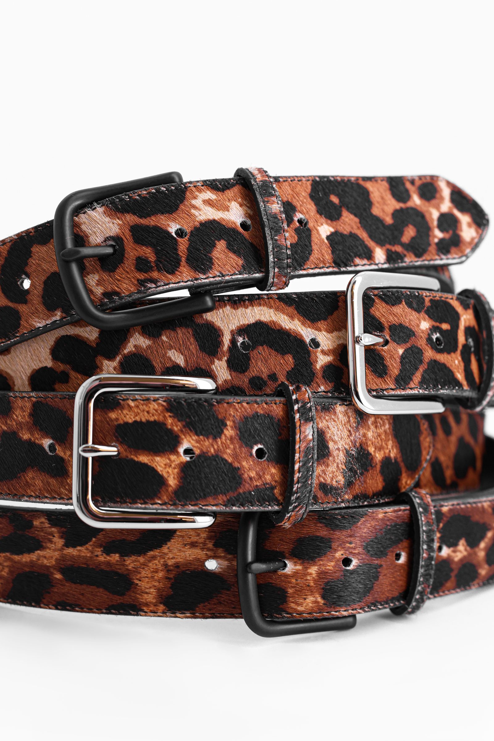 Coiled leopard calf hair belt showing buckles and stitching