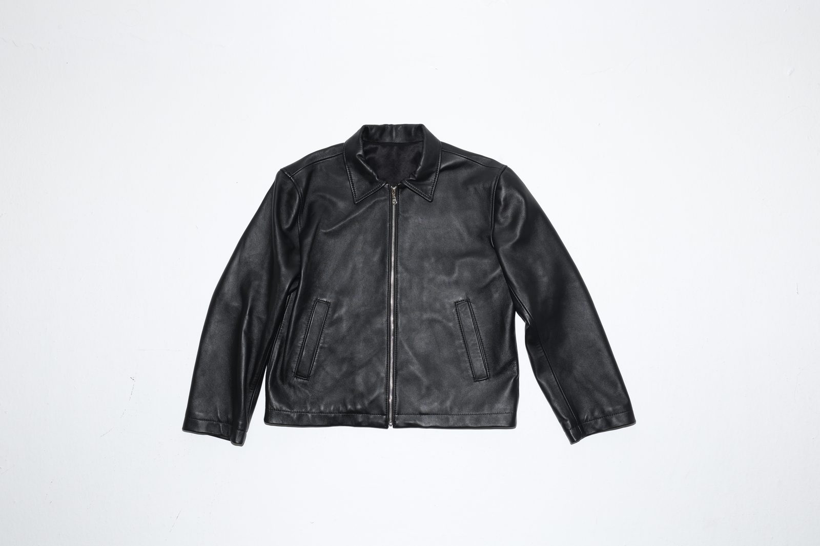 Nana Kwame Noir jacket, black calfskin leather with silver YKK zip, front view