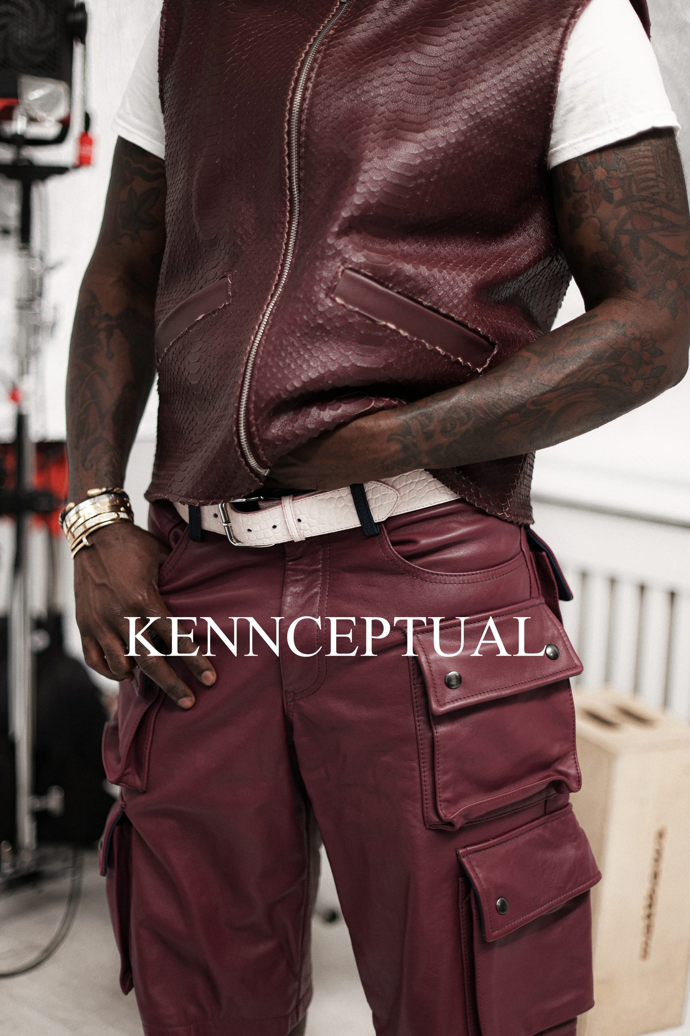 Detail of V2 Vest in bordeaux python worn with cargo pants