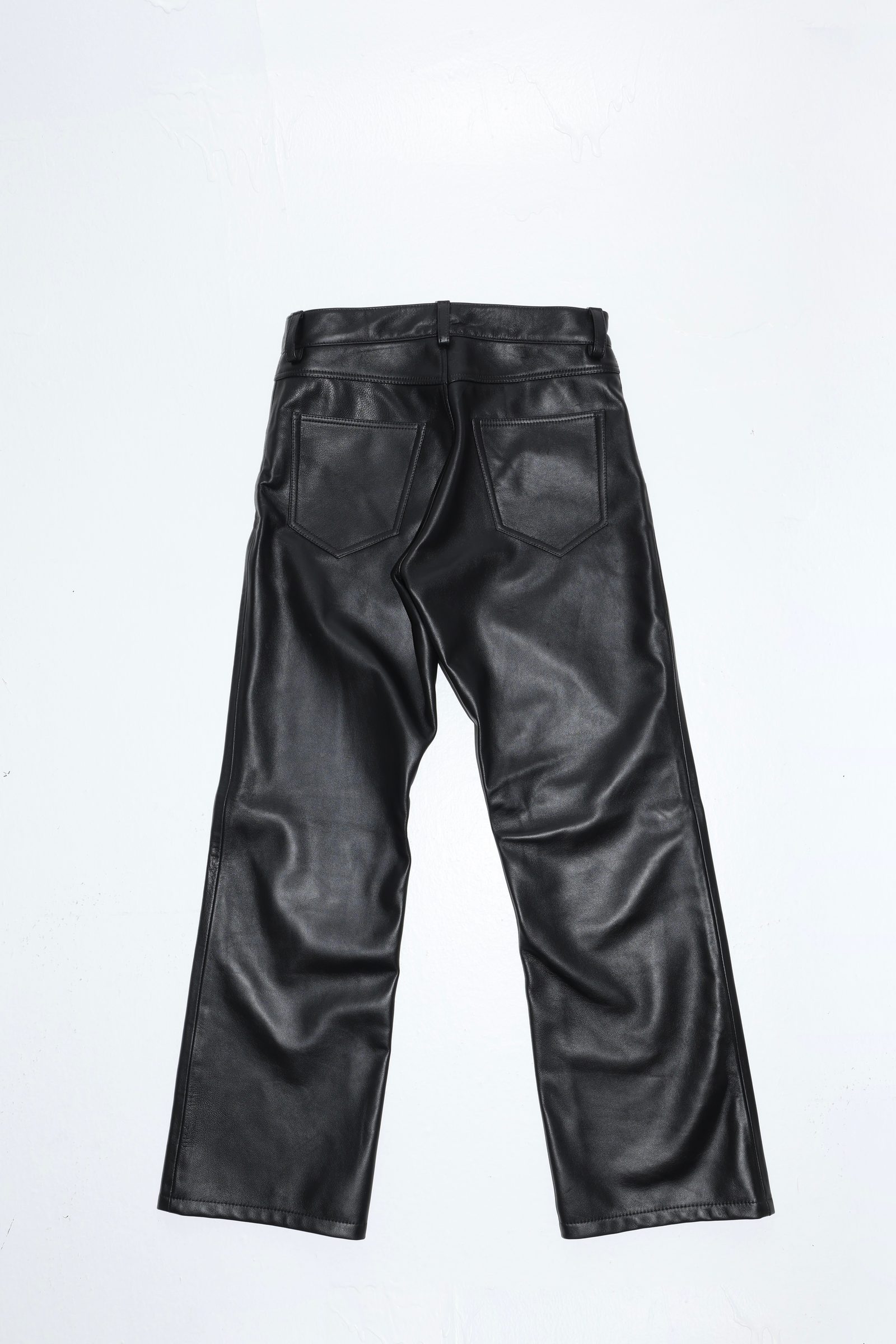 Back view of calf skin workman leather pants showing goat suede yoke and patch pockets
